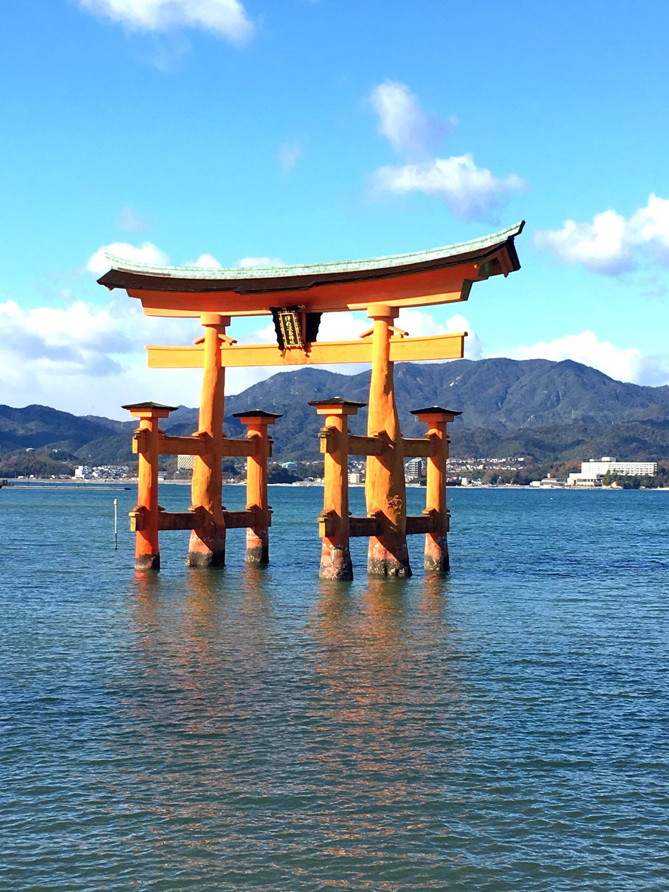 The floating torii gate at Miyajima under a blue sky